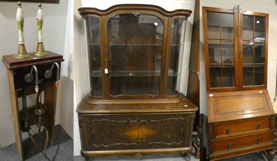 Lot 1186 - A side cabinet with glazed upper section and an oak bureau bookcase; together with a bar pump (3)