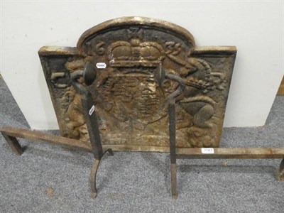 Lot 1187 - A pair of andirons and a fire back