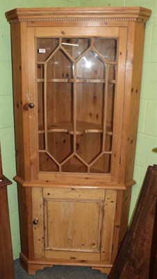 Lot 1205 - A glazed pine standing corner cupboard