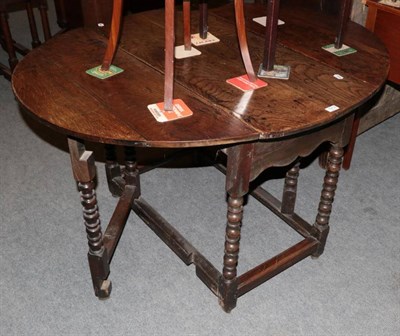 Lot 1212 - Early 18th century oak gateleg table with bobbin turned legs