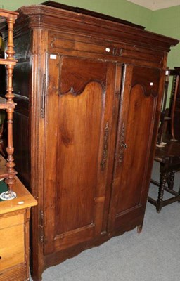 Lot 1214 - Early 18th century walnut armoire with moulded doors and a drawer