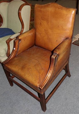 Lot 1247 - George III style library armchair upholstered in brown close-nailed leather