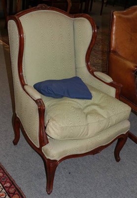 Lot 1248 - Louis XV style wingback chair, late 19th century, upholstered in green fabric