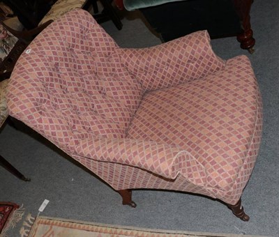 Lot 1253 - Victorian mahogany armchair recovered in buttoned fabric, raised on turned legs