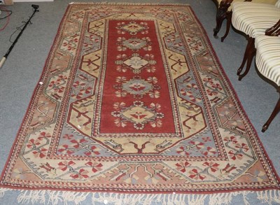 Lot 1258 - Melas Rug, West Anatolia, the chestnut field with five floral medallions framed by meandering...