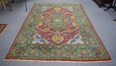 Lot 1264 - Very finely woven Petag design carpet, 20th century, the raspberry field centred by a cusped...