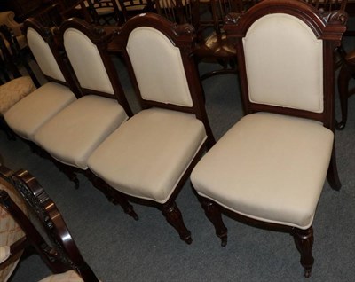 Lot 1270 - A set of four carved mahogany dining chairs upholstered in cream fabric