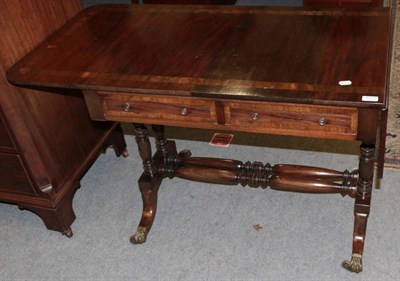 Lot 1277 - Regency style mahogany and cross banded sofa table