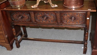 Lot 1280 - A 17th century style oak low dresser