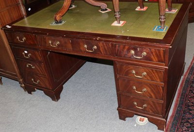 Lot 1294 - A green leather inset pedestal desk