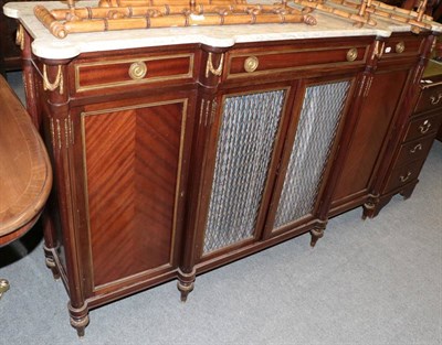 Lot 1295 - A French early 20th century mahogany and gilt metal mounted four-door cabinet with marble top