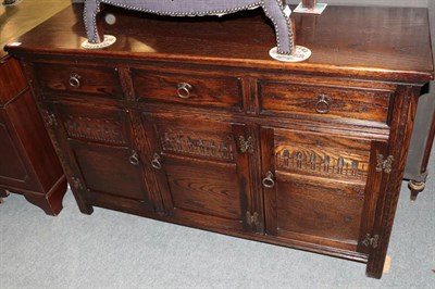 Lot 1302 - A Jaycee oak sideboard, modern, with three drawers above moulded cupboard doors, 132cm wide