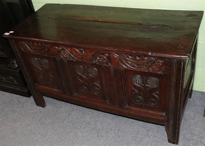 Lot 1307 - An 18th century carved oak coffer