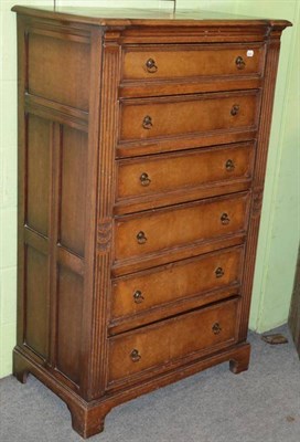 Lot 1312 - A 20th century oak six drawer straight fronted chest