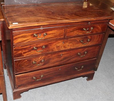 Lot 1313 - A George III mahogany four height chest of drawers of small proportions, fitted with a dressing...