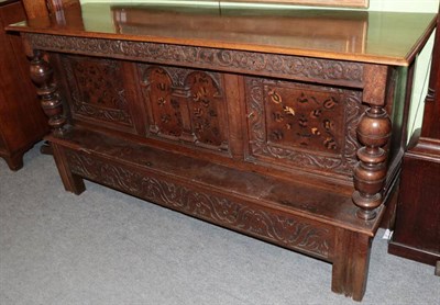 Lot 1322 - Carved oak sideboard, 17th century in part, with two marquetry inlaid cupboard doors