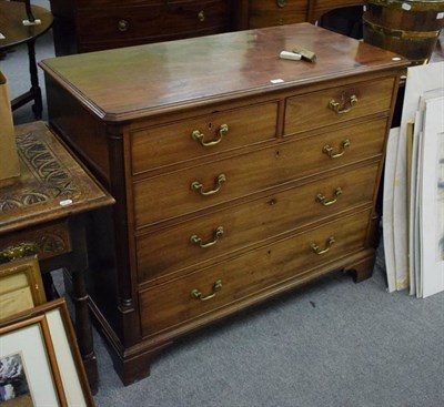 Lot 1328 - George III mahogany chest with fluted stiles