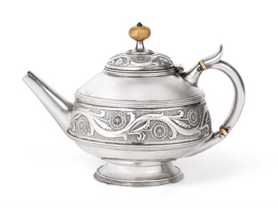 Lot 45 - A Victorian Silver Teapot, John Hardman & Co, Birmingham 1879, circular with angular spout on...