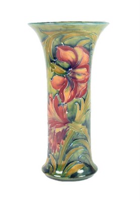 Lot 220 - William Moorcroft (1872-1945): A Spanish Pattern Trumpet Vase, on a blue/green ground, green...