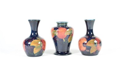 Lot 226 - William Moorcroft (1872-1945): A Matched Pair of Pomegranate Pattern Vases, on a blue ground,...