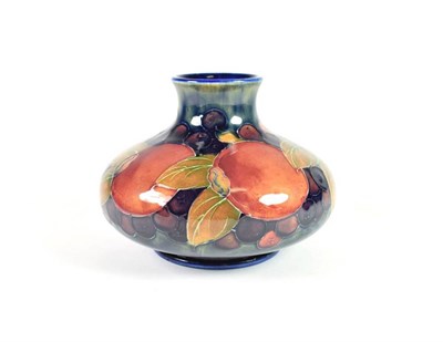 Lot 227 - William Moorcroft (1872-1945): A Pomegranate Pattern Squat Vase, on a blue ground, impressed...