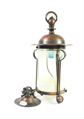 Lot 250 - An Arts & Crafts Copper Lacquer Hall Lantern, the domed top above a stylised frame with...