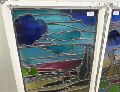 Lot 260 - Two Stained Glass Windows, depicting a windmill and cottage in a pastoral landscape, 90cm by 48cm
