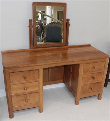 Lot 282 - Mouseman: A Robert Thompson of Kilburn English Oak Dressing Table, with fixed central pivoting...