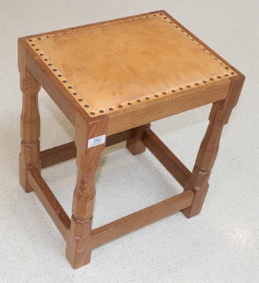 Lot 283 - Mouseman: A Robert Thompson of Kilburn English Oak Dressing Table Stool, with upholstered cow...