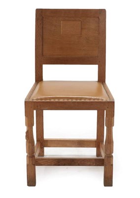 Lot 288 - Mouseman: A Robert Thompson of Kilburn English Oak Panel Back Dining Chair, upholstered nail...