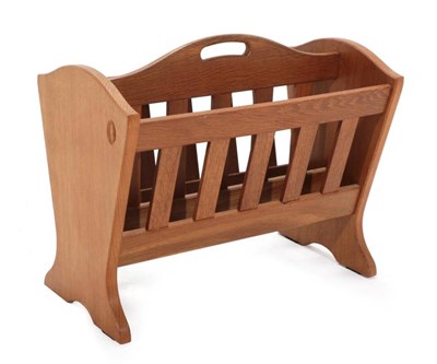 Lot 325 - Acorn Industries: A G.J.Grainger and Sons of Brandsby English Oak Magazine Rack, the shaped...