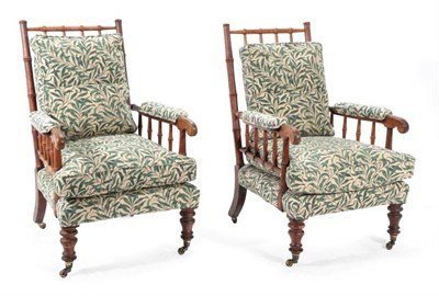 Lot 364 - A Pair of Victorian Oak Faux Bamboo Easy Chairs, upholstered in Morris & Co green Willow Bough...