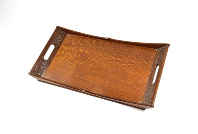 Lot 366 - An Arts & Crafts Oak Tray, by Hubert Simpson (1889-1975), circa 1928, the handles with carved...