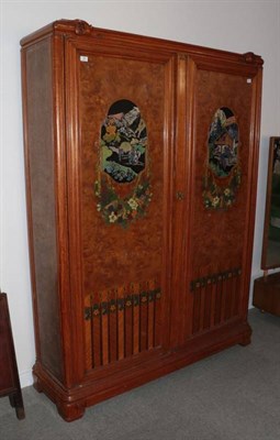 Lot 369 - An Art Deco Austrian Burr Walnut Armoire, with shaped cornice above two doors each inlaid with...