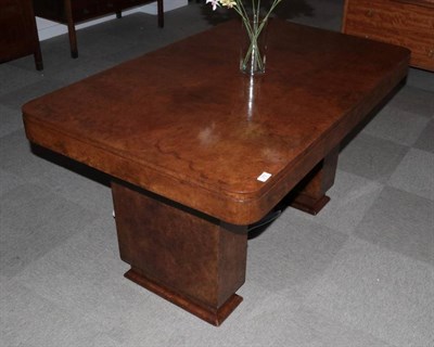 Lot 372 - An Art Deco Burr and Figured Walnut Dining Table, by Epstein, the rounded rectangular top on...