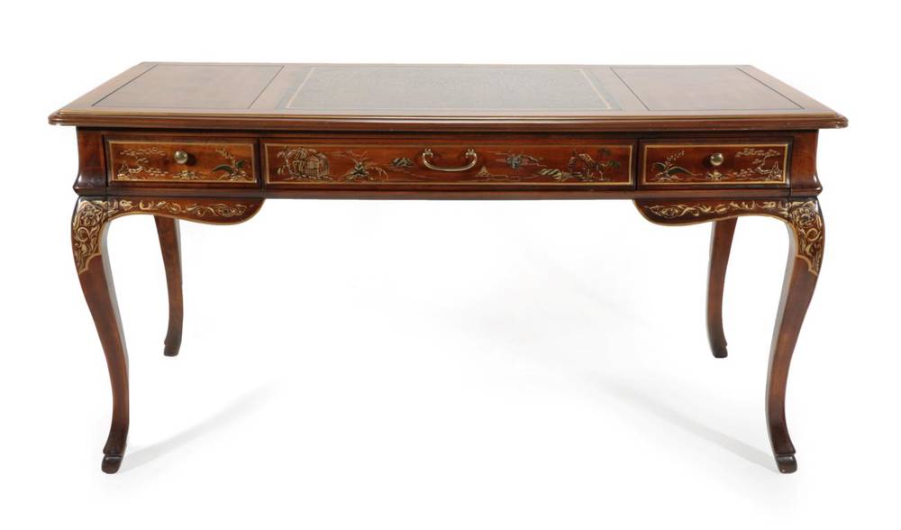 Lot 382 - A Drexel Walnut and Chinoiserie Decorated Writing Table, modern, with three long drawers above...