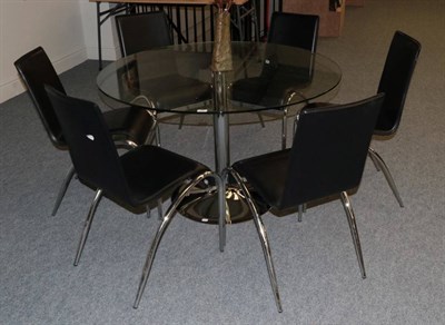 Lot 383 - A Circular Glass Top Table, modern, on a polished metal circular base, 120cm diameter; and Six...