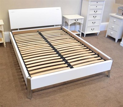 Lot 385 - A 4'6'' Electric Bed, modern, with white MDF frame and chromed legs