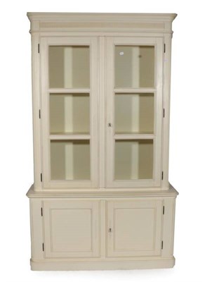 Lot 400 - A Laura Ashley Cream Painted Provençale Range Bookcase Cabinet, modern, with glazed doors...