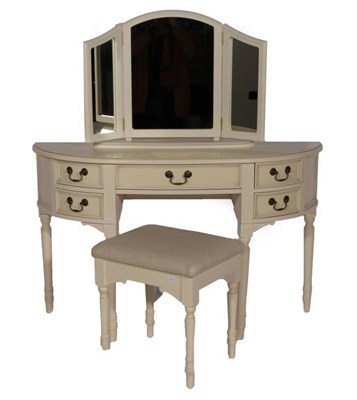 Lot 407 - A Laura Ashley Ivory Painted Clifton Range Bowfront Dressing Table, modern, with five drawers,...