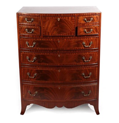 Lot 418 - A Reproduction Mahogany Bowfront Chest of Drawers, in Regency style, with four small drawers...