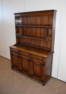Lot 425 - A Titchmarsh & Goodwin Oak Dresser and Rack, model RL.19855, modern, the rack with two fixed...