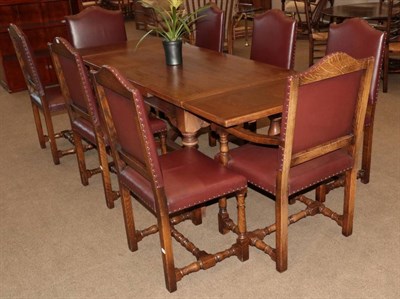 Lot 432 - A Set of Eight Dining Chairs, modern, including two carvers, upholstered in burgundy...