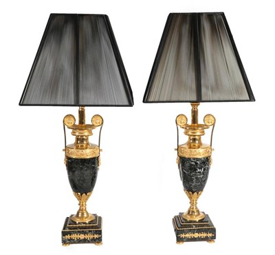 Lot 440 - A Pair of Versace Gilt Metal and Green Marble Table Lamps, modern, in Louis XV style, with...