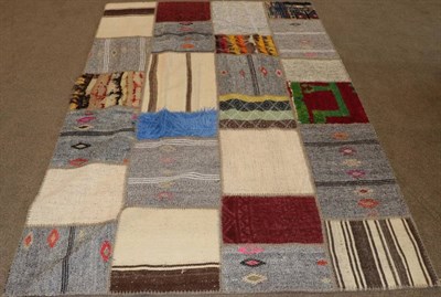 Lot 452 - A ''Modernist'' Patchwork Carpet, comprised of various polychrome panels, 240cm by 165cm