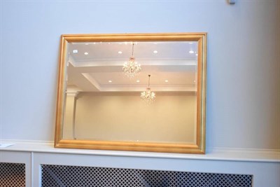 Lot 457 - A Gilt Framed Bevelled Glass Mirror, modern, of rectangular form with moulded frame, 136cm by 104cm