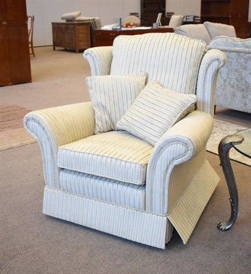Lot 462 - A Wing-Back Armchair, modern, labelled Steed, upholstered in narrow stripe and gold cord...