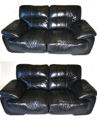 Lot 465 - A Pair of Black Leather Two-Seater Sofas, modern, with padded arms, on polished metal feet,...