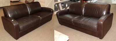 Lot 476 - A Pair of Dark Brown Leather Three-Seater Sofas, circa 2003, with two squab cushions and...