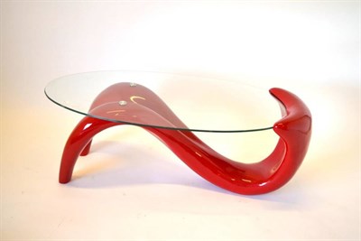 Lot 487 - An Italian Style Red Painted and Glass Top Table, of Modernist form, with oval glass top and curved